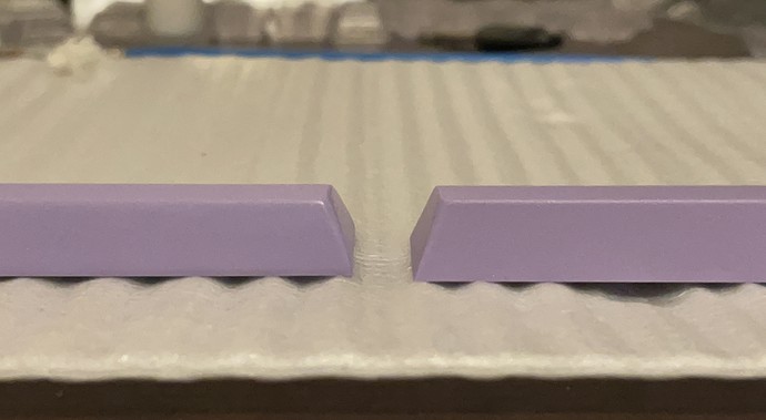 Front-view closeup, comparing spacebars