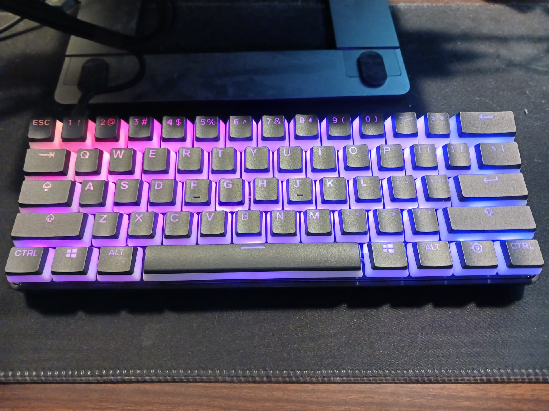 Apex 9 Mini with lubed switches and stabs, prism keycaps, and band